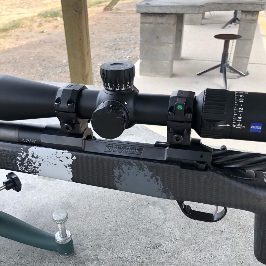 detail view of bolt action rifle at shooting range